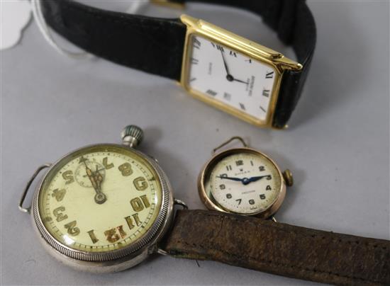 A ladys gold Rolex Precision watch and two other watches.